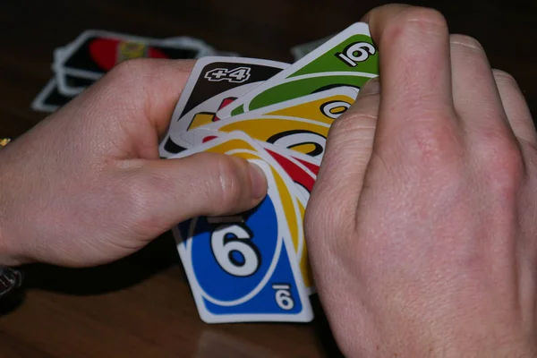 Uno cards in hand, card game Stock Photo by ©Egor_1896 239236398